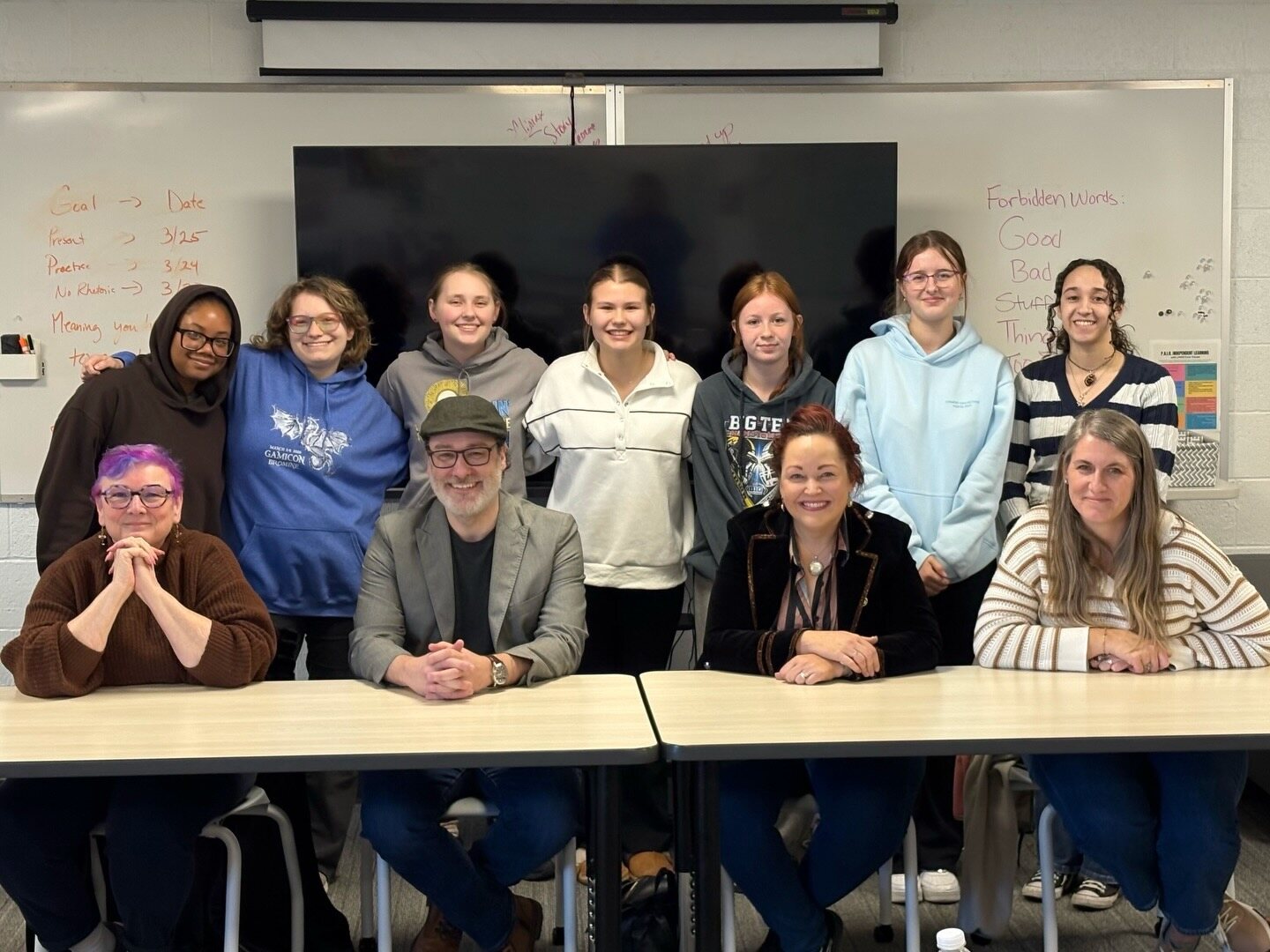 Craig A. Hart with students during a school visit